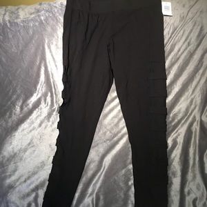 Black leggings with lattice mesh down leg on side